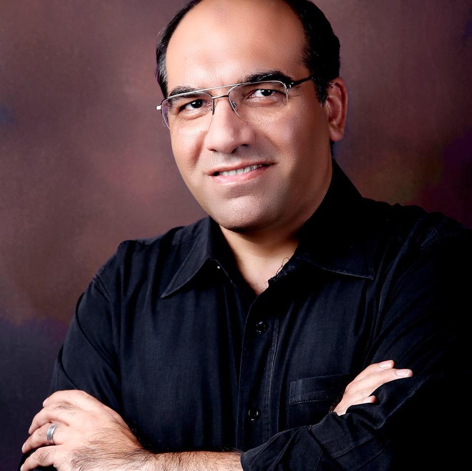 Portrait of author Ahmed Al-Qadi